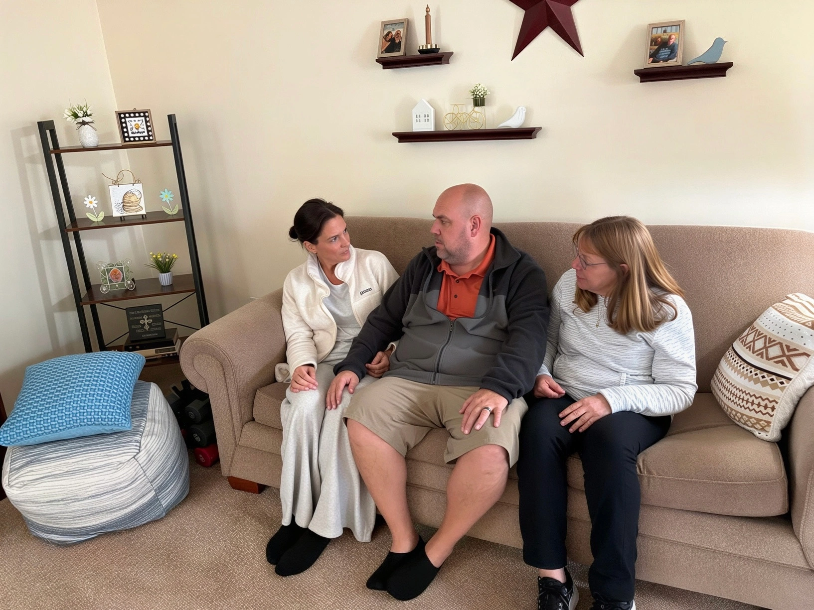 Three people chatting together on the couch at home