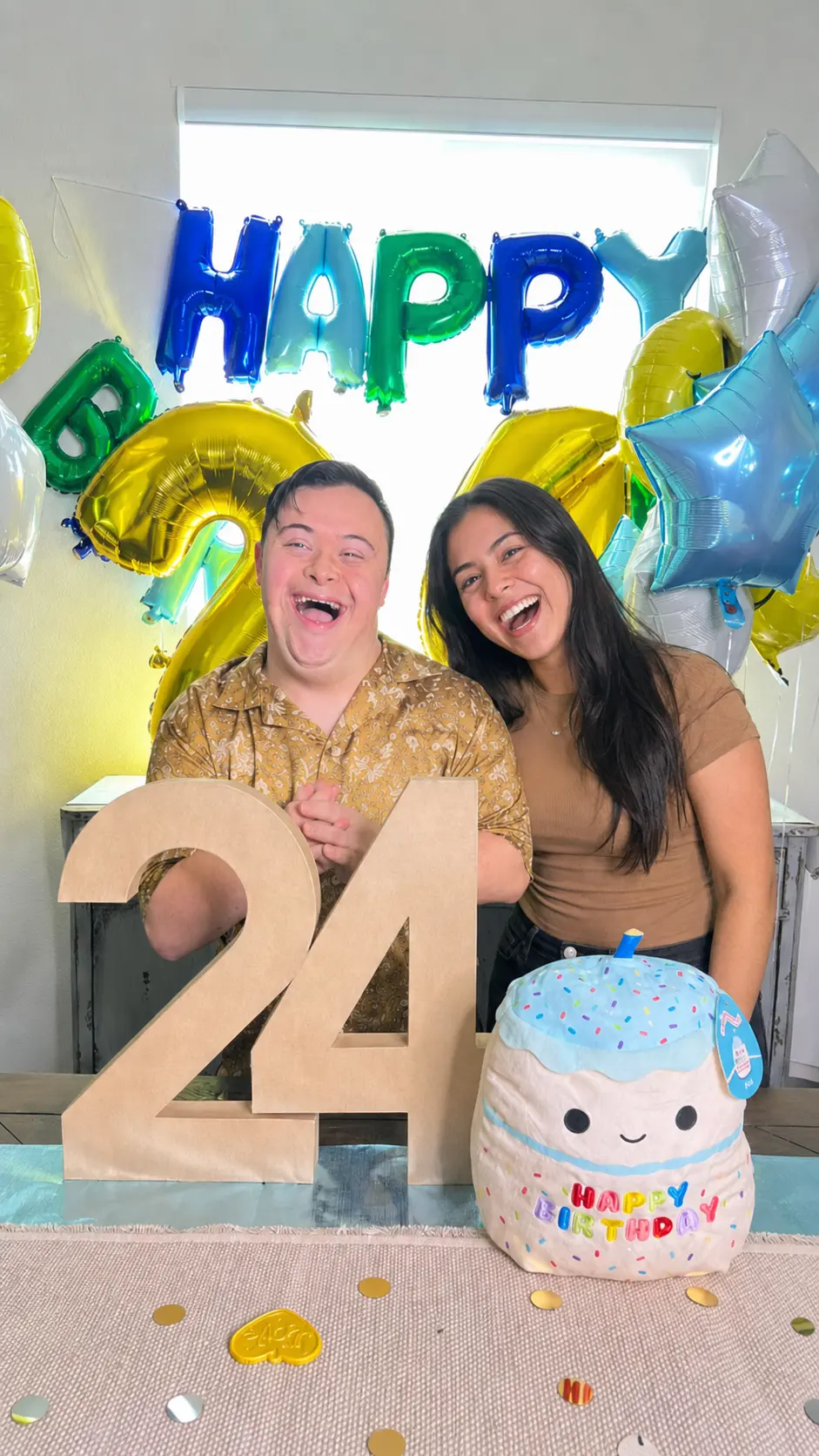 Birthday celebration with balloons and cake